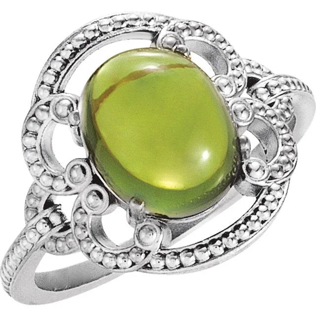 14KT GOLD 2.50 CTW OVAL PERIDOT GRANULATED DESIGN RING