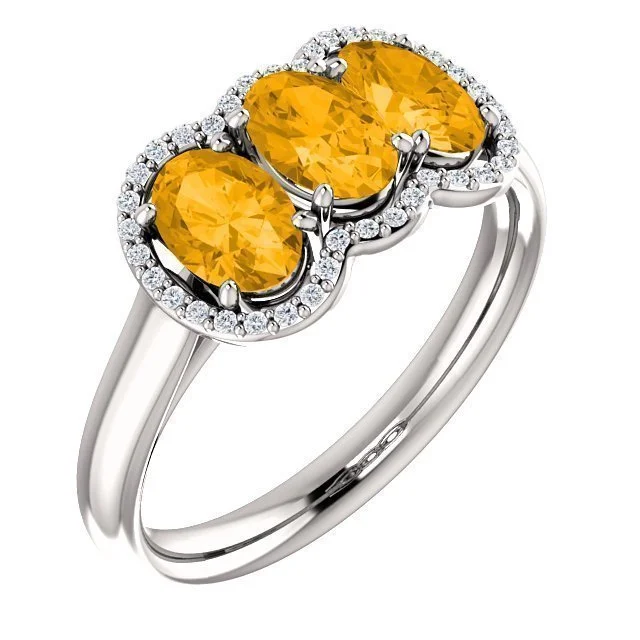 14KT GOLD 1.32 CTW CITRINE & 0.10 CTW DIAMOND 3 STONE OVAL HALO RING