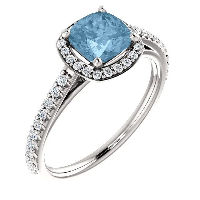 PLATINUM 1.42 CT SKY BLUE TOPAZ & 1/3 CTW DIAMOND HALO RING