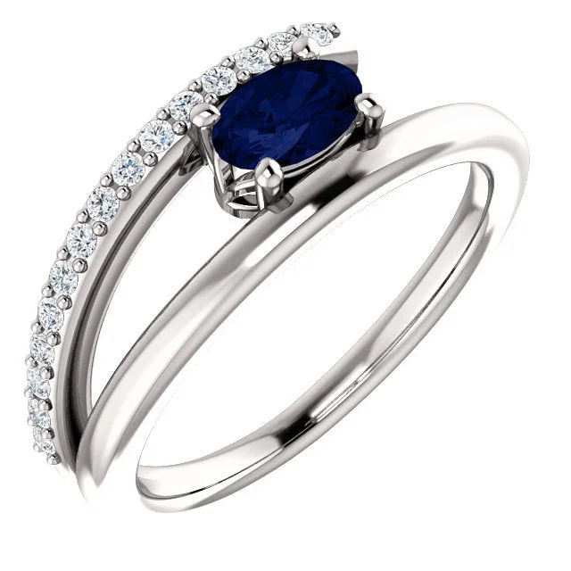 14KT GOLD BLUE SAPPHIRE & 1/8 CTW DIAMOND BYPASS RING