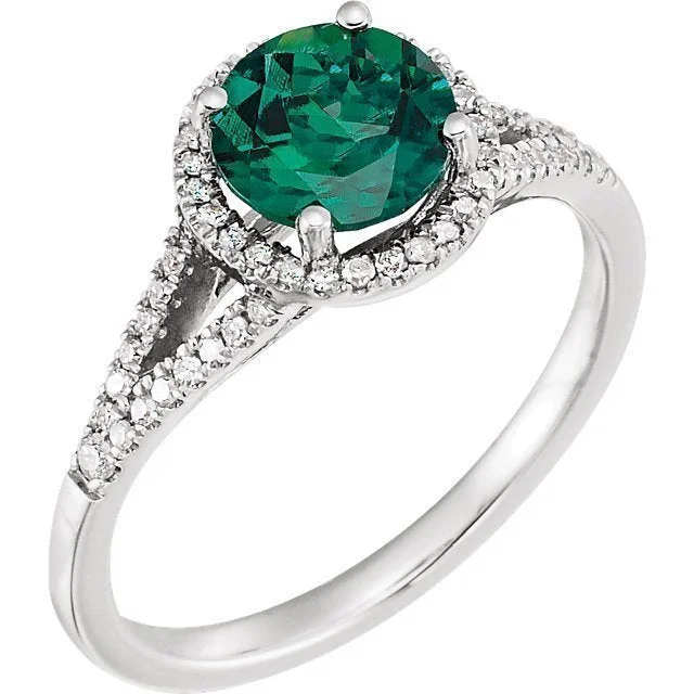 14KT WHITE GOLD 1 1/4 CT LAB CREATED EMERALD & 1/6 CTW DIAMOND HALO RING